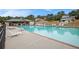 Community pool and clubhouse with lounge chairs for relaxing by the water at 92 River Walk Pkwy, Euharlee, GA 30145