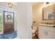 Convenient powder room featuring granite counters, wood floors, and stylish fixtures at 92 River Walk Pkwy, Euharlee, GA 30145