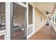 Inviting screened porch features a wooden deck, ceiling fans, and views of the outdoor surroundings at 92 River Walk Pkwy, Euharlee, GA 30145