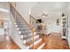 Elegant staircase with wooden treads and decorative iron railings, leading to the living area at 92 River Walk Pkwy, Euharlee, GA 30145
