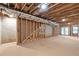 Unfinished basement featuring exposed duct work and wooden beams at 1464 Ezra Church Nw Dr, Atlanta, GA 30314