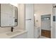 Bright bathroom featuring double sinks and a modern rectangular mirror and brushed black fixtures at 1464 Ezra Church Nw Dr, Atlanta, GA 30314