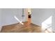 An empty bedroom with light wood floors and a closet with a door at 1464 Ezra Church Nw Dr, Atlanta, GA 30314