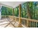 Spacious wooden deck perfect for outdoor relaxation, surrounded by lush greenery at 1464 Ezra Church Nw Dr, Atlanta, GA 30314