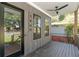 Welcoming front porch with a ceiling fan, black railing, and home number 1464 fixed to the exterior at 1464 Ezra Church Nw Dr, Atlanta, GA 30314
