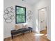 Bench with decorative pillows in the hallway with decorative wall art at 1464 Ezra Church Nw Dr, Atlanta, GA 30314