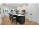 Bright kitchen features a large island with seating, modern white cabinets, and pendant lighting at 1464 Ezra Church Nw Dr, Atlanta, GA 30314