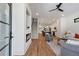 A spacious open-concept living area with hardwood floors, modern fireplace, staircase, and open to kitchen at 1464 Ezra Church Nw Dr, Atlanta, GA 30314