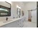 Elegant bathroom featuring double vanity, modern mirrors, and large shower at 1464 Ezra Church Nw Dr, Atlanta, GA 30314