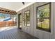 Inviting front porch features gray siding, wood flooring, and black-framed windows at 1464 Ezra Church Nw Dr, Atlanta, GA 30314