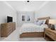 Comfortable main bedroom with carpet, windows, and a wood dresser at 2133 Kirkham Way, Kennesaw, GA 30152