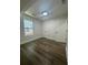 Bedroom featuring hardwood floors, recessed lighting, baseboard trim and a window view to the outdoors at 2228 Carey Se Dr, Atlanta, GA 30315
