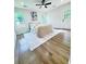 Well-lit bedroom featuring vinyl floors, a ceiling fan, and a door leading to the backyard at 2228 Carey Se Dr, Atlanta, GA 30315