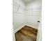 Walk-in closet featuring vinyl flooring and ample shelving for storage and organization at 2228 Carey Se Dr, Atlanta, GA 30315
