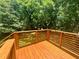 Wood deck perfect for entertaining with views of wooded back yard at 2228 Carey Se Dr, Atlanta, GA 30315