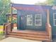 Home's inviting front porch with wooden details, enhancing its curb appeal at 2228 Carey Se Dr, Atlanta, GA 30315