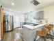 The gray and white kitchen, featuring stainless steel appliances, blends style and function at 2228 Carey Se Dr, Atlanta, GA 30315