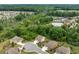 Community aerial view features mature landscaping, clubhouse, community pool and tennis courts at 2330 Cheatham Creek Ct, Cumming, GA 30040