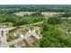 Aerial view of the home and surrounding cul-de-sac neighborhood amid mature trees at 2330 Cheatham Creek Ct, Cumming, GA 30040