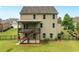 Charming backyard with a wooden deck and stairs leading to the yard, surrounded by a black fence at 2330 Cheatham Creek Ct, Cumming, GA 30040