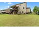 Well-manicured lawn with a spacious backyard and deck area, perfect for outdoor entertaining at 2330 Cheatham Creek Ct, Cumming, GA 30040