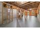 Spacious unfinished basement with open ceiling, concrete walls, and natural light at 2330 Cheatham Creek Ct, Cumming, GA 30040