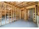 Spacious unfinished basement featuring a concrete floor, open ceiling, and ample room for storage at 2330 Cheatham Creek Ct, Cumming, GA 30040