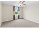 Bright bedroom with large window offering natural light and neutral decor at 2330 Cheatham Creek Ct, Cumming, GA 30040