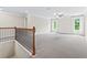 Large bonus room with natural light, ideal for a playroom, office, or media center at 2330 Cheatham Creek Ct, Cumming, GA 30040