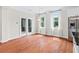 Bright, airy dining area with hardwood floors, natural light from large windows, and doors to outdoor space at 2330 Cheatham Creek Ct, Cumming, GA 30040