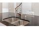 Close-up on a granite countertop and stainless steel sink in a bright kitchen at 2330 Cheatham Creek Ct, Cumming, GA 30040