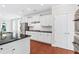 Well-lit kitchen with white cabinetry, stainless steel appliances, and granite countertops at 2330 Cheatham Creek Ct, Cumming, GA 30040