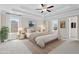 Luxurious main bedroom with tray ceilings and serene decor, creating a relaxing retreat at 2330 Cheatham Creek Ct, Cumming, GA 30040