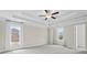 Bright and airy main bedroom features large windows and ample space for furniture arrangement at 2330 Cheatham Creek Ct, Cumming, GA 30040