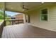 Relaxing covered patio with wooden floors, providing a comfortable outdoor living space at 2330 Cheatham Creek Ct, Cumming, GA 30040