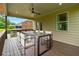 Inviting covered patio featuring a dining table and chairs, perfect for outdoor entertaining at 2330 Cheatham Creek Ct, Cumming, GA 30040
