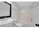 Clean and modern bathroom with a framed mirror, stylish sink, and a shower/tub combo at 25 Carriage Ct, Stockbridge, GA 30281