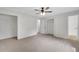 Spacious bedroom with three closets, ceiling fan, and natural light at 25 Carriage Ct, Stockbridge, GA 30281