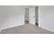 Cozy bedroom featuring neutral carpeting, paint, and natural light with a large closet at 25 Carriage Ct, Stockbridge, GA 30281