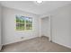 Bright bedroom featuring a window and closet, offering a comfortable and functional living space at 25 Carriage Ct, Stockbridge, GA 30281