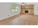 Inviting living room with stone fireplace and a large window filling the room with natural light at 25 Carriage Ct, Stockbridge, GA 30281