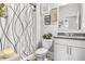 Bathroom featuring decorative shower curtain, neutral tones, and stylish decor at 3210 Ancoats St, Douglasville, GA 30135