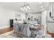 Elegant dining area open to the kitchen, ideal for entertaining, with stylish lighting and décor at 3210 Ancoats St, Douglasville, GA 30135