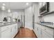 Bright kitchen with stainless steel appliances, granite countertops, and ample cabinet space at 3210 Ancoats St, Douglasville, GA 30135
