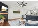 Comfortable living room with a fireplace, plush seating, and a decorative wall feature at 3210 Ancoats St, Douglasville, GA 30135