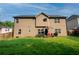 Expansive backyard featuring a patio, lush lawn, and a privacy fence, great for outdoor living and entertaining at 4560 Buckskin Way, Douglasville, GA 30135
