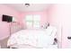 Shared ' bedroom featuring two beds, a dresser with mirror, and a window with blinds at 4560 Buckskin Way, Douglasville, GA 30135