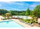 Enjoy the community pool with ample lounging chairs, umbrellas and a beautiful cabana for relaxation and recreation at 4560 Buckskin Way, Douglasville, GA 30135