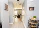 Hallway featuring wood flooring, neutral decor, and access to multiple rooms, for easy navigation at 4560 Buckskin Way, Douglasville, GA 30135