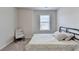 Bright bedroom with a twin bed, chair, and a window providing natural light at 94 Depot Landing Rd, Auburn, GA 30011